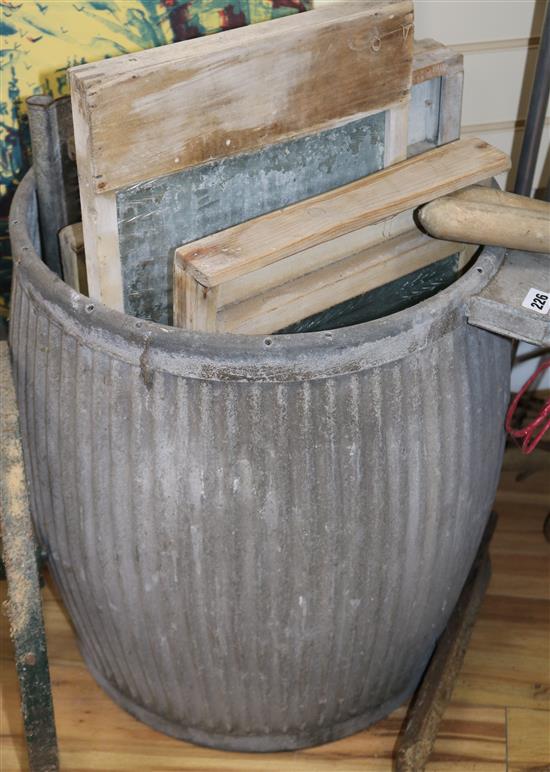 A collection of wash boards and a galvanised tin wash tub